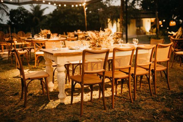 Garden dinner table under festoon lighting