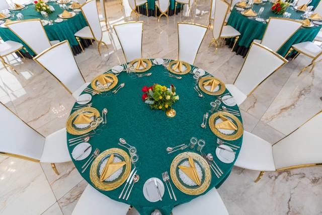 Emerald and gold banquet table setting