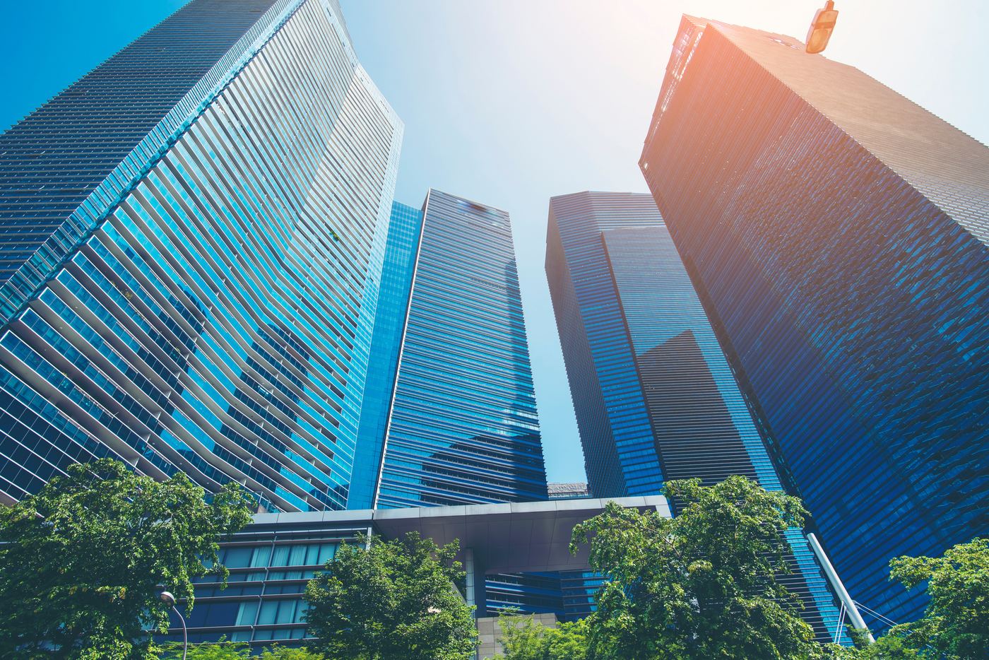 Modern city towers representing the SYNTAX international delivery network